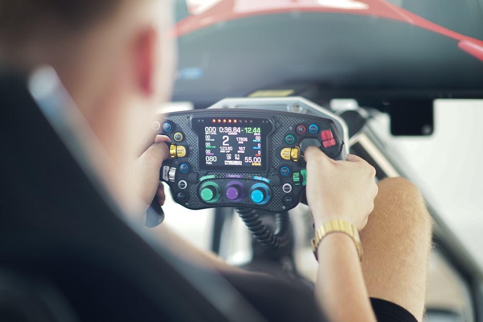 A sim racing steering wheel at PaddlUp