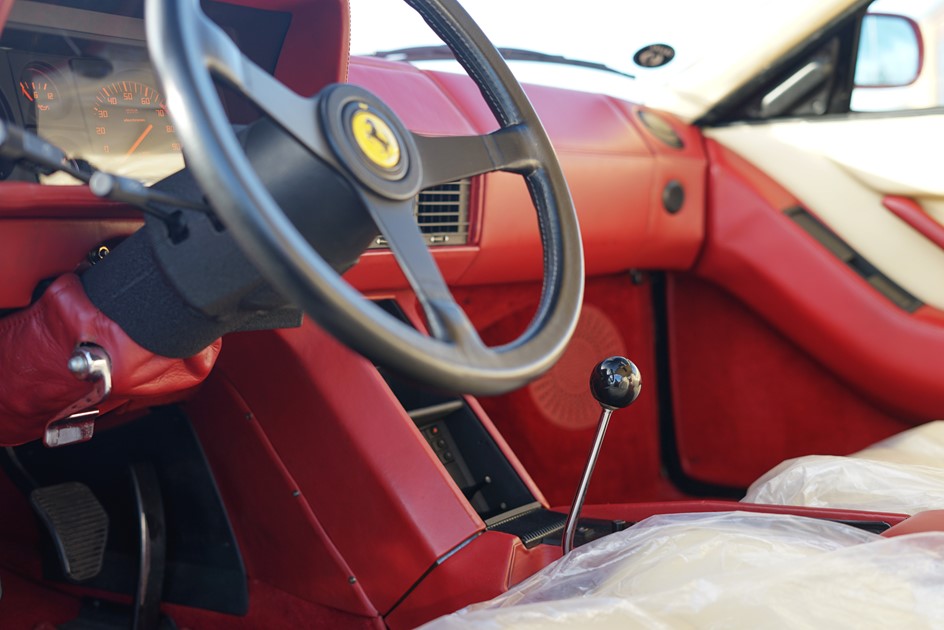 The interior and gated manual gearbox of a Ferrari Testarossa 