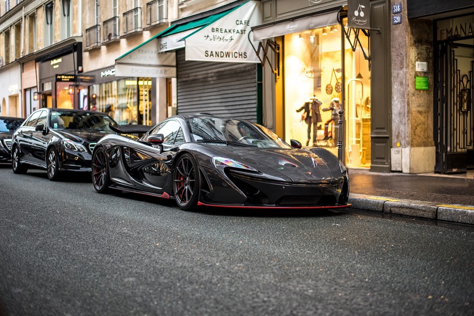 A McLaren P1 on a French city street